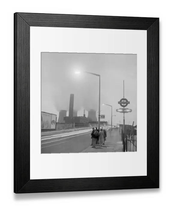 Framed Print : Bus stop queue and power station a071671