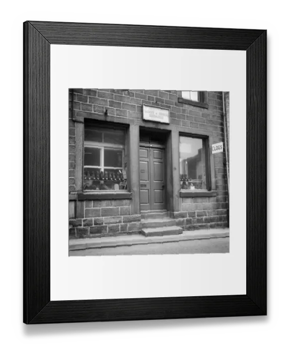 Framed Print : Clog, boot and shoe shop DES01_01_0766