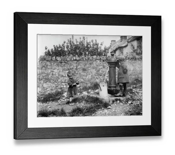 Framed Print : Two children collecting water at a water pump MCF01_02_0182
