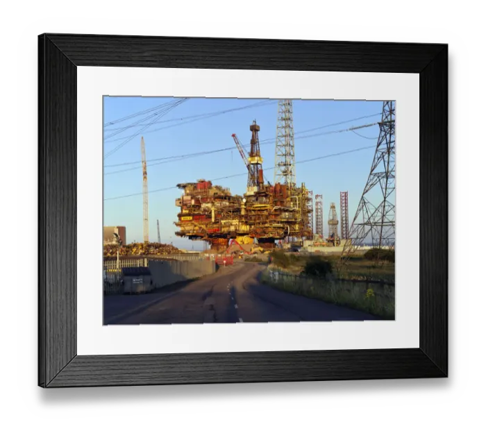 Framed Print : Decommissioned oil rig DP249057