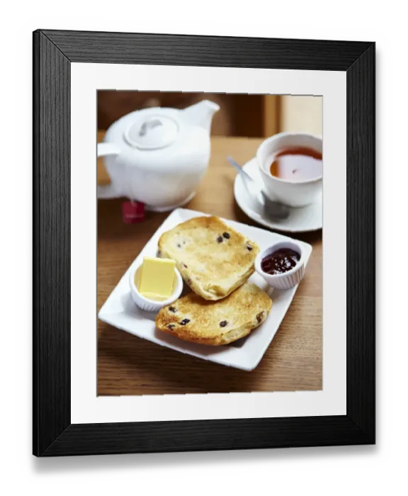 Framed Print : Teacake with butter and jam and a pot of tea N100359