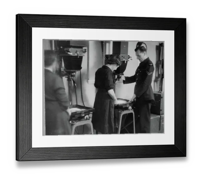 Framed Print : RAF instructor directing a WAAF trainee in the use of photographic enlargers chp01_07_01_065