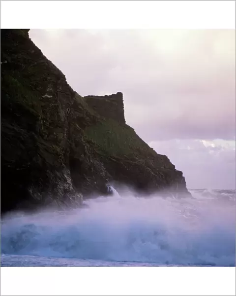 Waves crashing against the coastline K900464