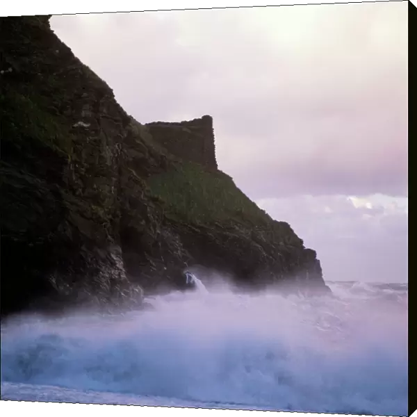 Waves crashing against the coastline K900464