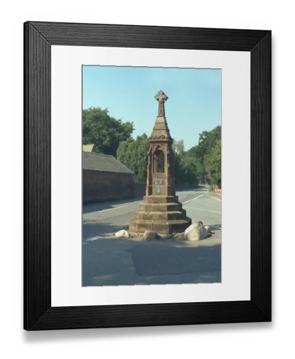 Framed Print : Cross stands on the site of the lock-up of the ancient manor Framed Print : Cross stands on the site of the lock-up of the ancient manor