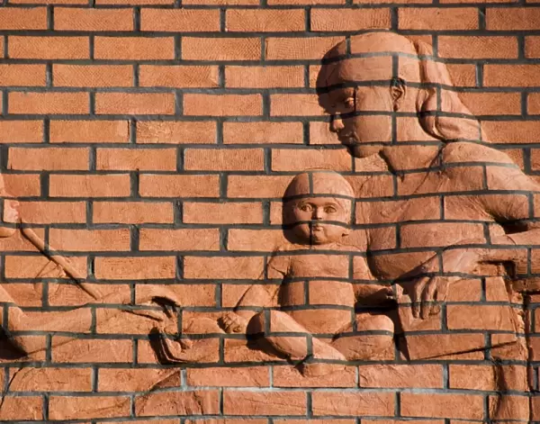 Brick relief of mother and children DP035286