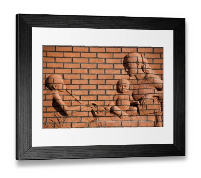 Framed Print : Brick relief of mother and children DP035286