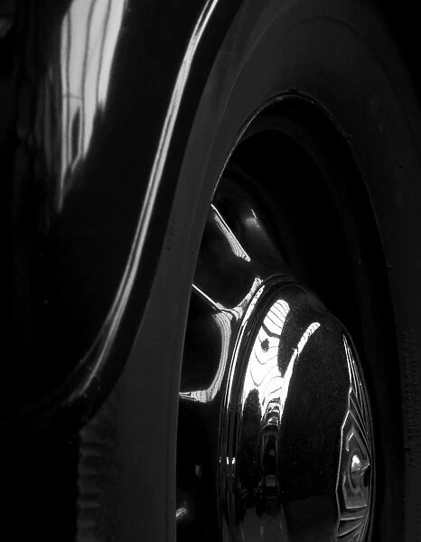 Car wheel DP057384. Abstract detail of black car's wheel and wheel arch