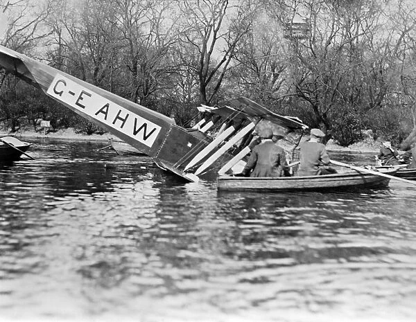 Crash EPW000213. Crashed aircraft. People in rowing boat investigating the wreckage