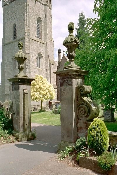 Gate Piers. Two square piers topped with vases supporting a pineapple. IoE 153457