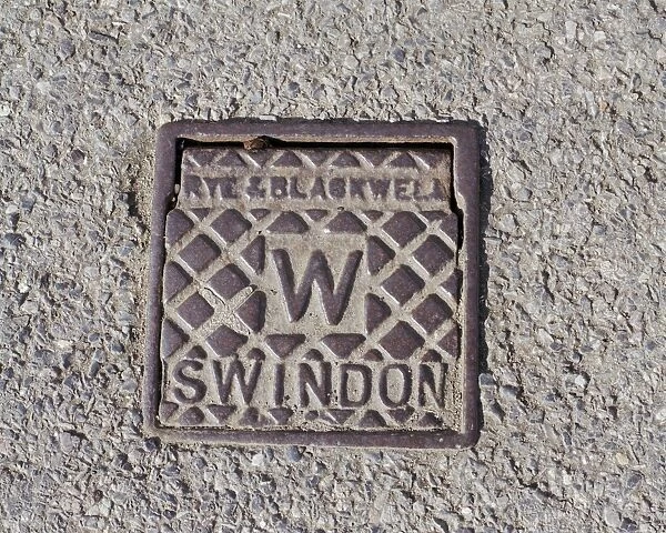 Ironwork a059420. Swindon, Wiltshire. A water stop tap cover plate made by Rye