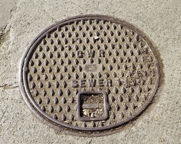 Ironwork AA059332. Swindon, Wiltshire. Detail of a GWR sewer inspection cover plate