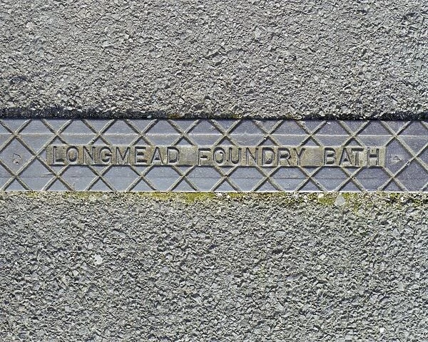 Ironwork AA059415. Swindon, Wiltshire. A pavement rainwater gully cover