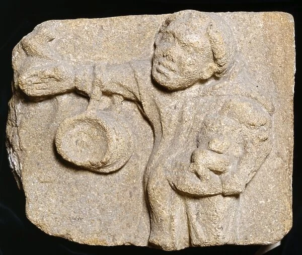 Monk K900091. Muchelney Abbey, Somerset. Carved stone on display depicting