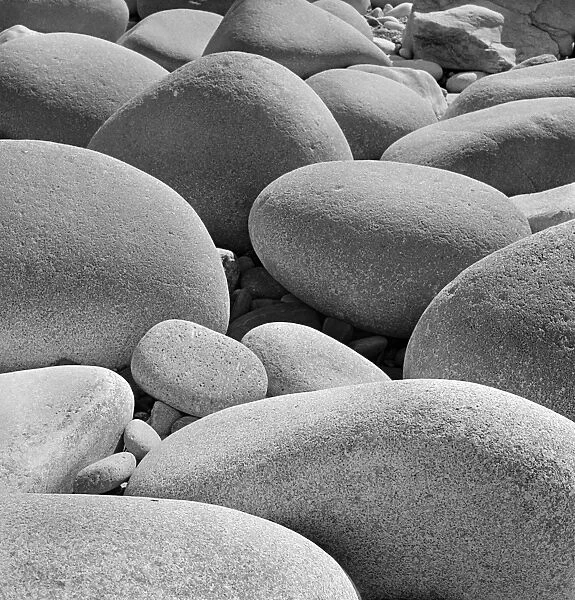 Pebbles AA087193. A close-up view of sea-worn rocks and pebbles on a Cornwall beach