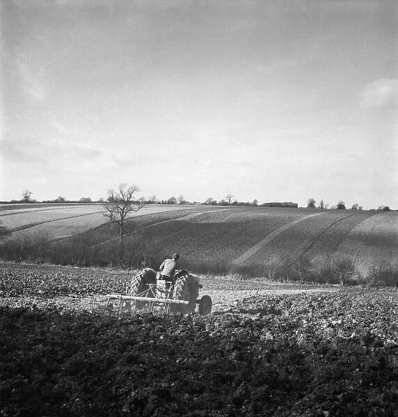 Ploughing a076208. A field in Hertfordshire, being ploughed by a man on a tractor