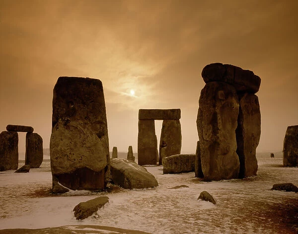 Stonehenge J850009. STONEHENGE, Wiltshire. View of stones in the snow at sunset