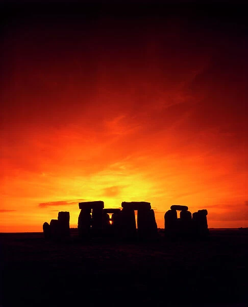 Stonehenge J870239. STONEHENGE, Wiltshire. Mid-summer sunset
