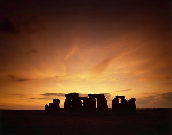 Stonehenge J870243. STONEHENGE, Wiltshire. Mid-summer sunset
