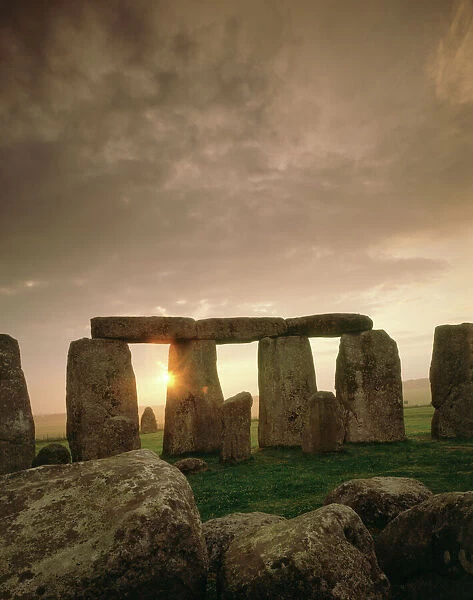 Stonehenge J870244. STONEHENGE, Wiltshire. Midsummer sunrise. Sarsen Circle and Heel Stone