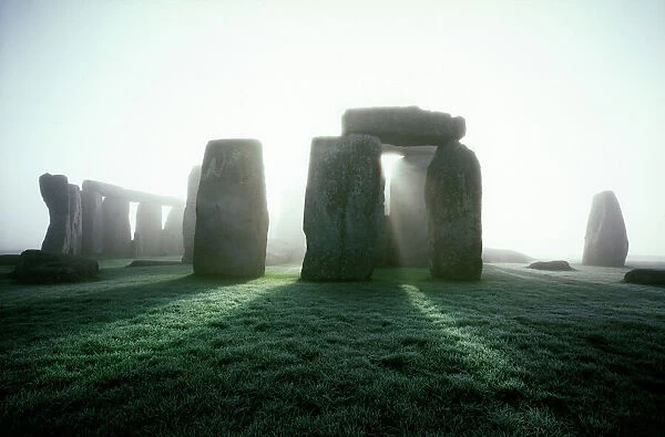 Stonehenge K022290. STONEHENGE, Wiltshire. Misty view from the North East at sunrise