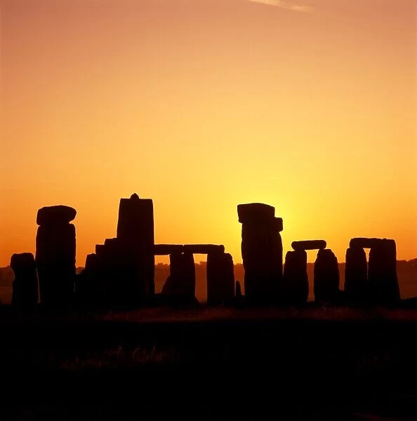 Stonehenge K930566. STONEHENGE, Wiltshire. Silhouette of the stones at sunrise