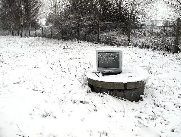 Terminal DP087396. Snow covered computer monitor on a raised manhole