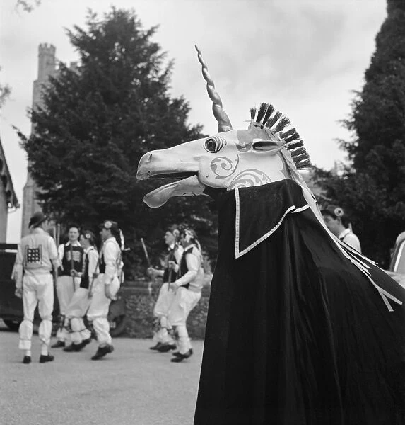 Unicorn AA089655. The Unicorn of the Westminster Morris Men with a stick dance in progress