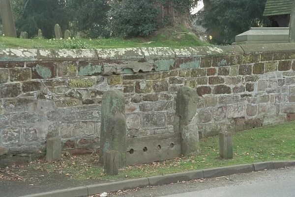 Village Stocks. Rectangular stone posts have original slots