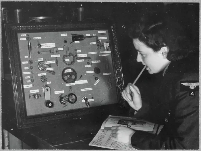Framed Print : A Women's Auxiliary Air Force (WAAF) trainee revising the components of a camera gear box chp01_07_01_050