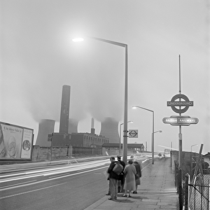 Bus stop queue and power station a071671