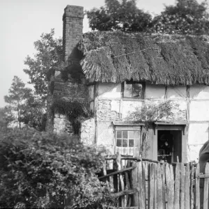 Thatched Cottage Print with Woman in Garden