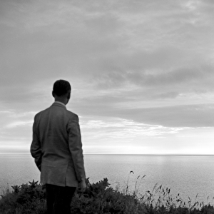Man looking out to sea a002229