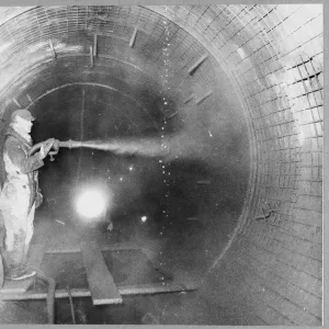 Concrete spraying print, worker in south tunnel