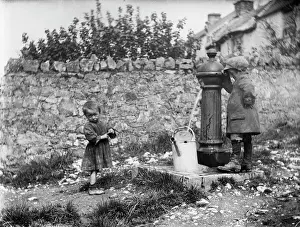 Children Prints: Two children collecting water at a water pump MCF01_02_0182