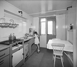Childhood Collection: Girl in prefab kitchen P_H00049_007