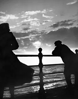 Silhouette Collection: Man and woman looking out to sea OP04504