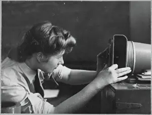 Member of the Women's Auxiliary Air Force (WAAF) using an aerial camera chp01_07_01_045