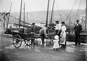 Victorian people and costumes Collection: Water carrier, Newlyn Harbour a97_05334