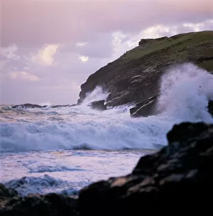 Arthur Collection: Waves crashing against the coastline K900459