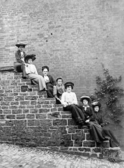 Victorian people and costumes Collection: Women sitting on steps BB98_02393