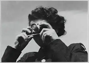 Second World War Prints: A Women's Auxiliary Air Force (WAAF) trainee practising using a miniature handheld camera chp01_07_01_078
