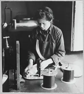 Second World War Prints: A Women's Auxiliary Air Force (WAAF) trainee cleaning darkroom apparatus chp01_07_01_055