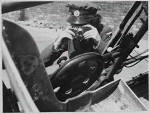 Second World War Prints: A Women's Auxiliary Air Force (WAAF) trainee practising with a miniature handheld camera chp01_07_01_077