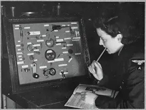 Second World War Prints: A Women's Auxiliary Air Force (WAAF) trainee revising the components of a camera gear box chp01_07_01_050