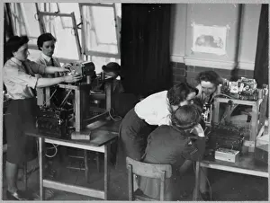 Second World War Prints: Women's Auxiliary Air Force (WAAF) trainees learning about aerial camera assembly chp01_07_01_046