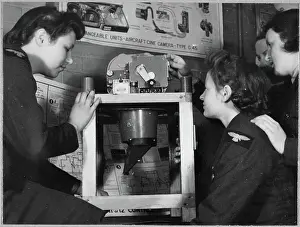 Second World War Prints: Women's Auxiliary Air Force (WAAF) trainees working on an F24 camera chp01_07_01_047